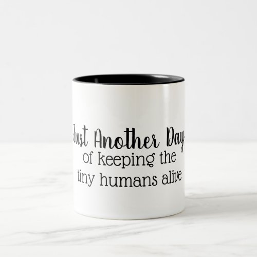 Keeping Tiny Humans Alive Two_toned mug