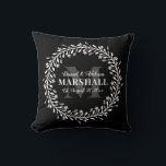 Keepsake Newlywed Couple Wreath Monogram Name Throw Pillow<br><div class="desc">Floral Wreath Calligraphy Typography Monogram Throw Pillow in Black and White - Stylish black and white monogrammed throw pillow gift for a newly wed couple that features a custom monogram, groom & bride names, last name, and wedding date templates surrounded by a bold floral line art wreath. A thoughtful keepsake...</div>