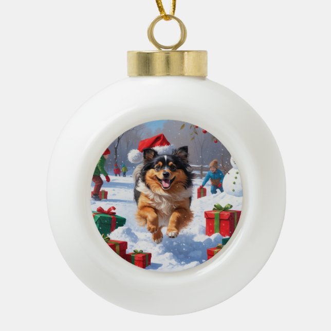Keeshond Dog Running in Snow with Christmas Hat Ceramic Ball Christmas Ornament (Front)