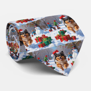 Keeshond Dog Running in Snow with Christmas Hat Neck Tie