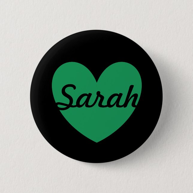 Kelly green polka hearts on black pinback button (Front)