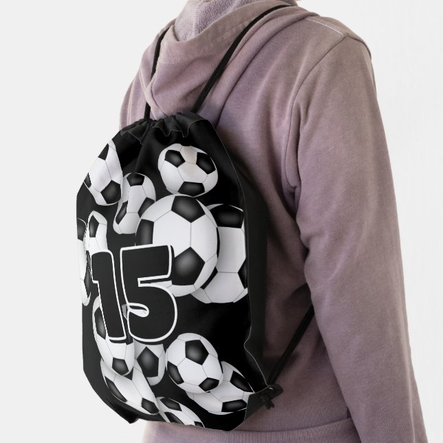 kids jersey number on group of soccer balls drawstring bag (Insitu)
