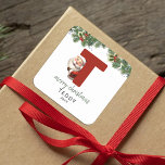 Kids Monogram Christmas Square Sticker<br><div class="desc">Give the gift of personalized charm this Christmas! Our monogram stickers,  featuring Santa hiding behind the letter T,  are a unique and thoughtful way to show your love. Customize with a name,  year and a heartfelt greeting. Make your Christmas gifts stand out!</div>