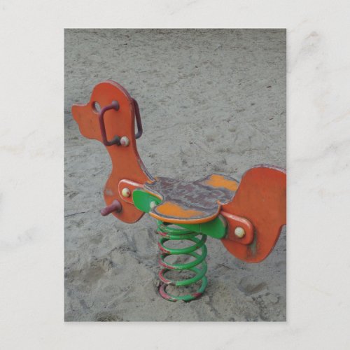 Kids Playground Orange Dog Toy in Sand Postcard