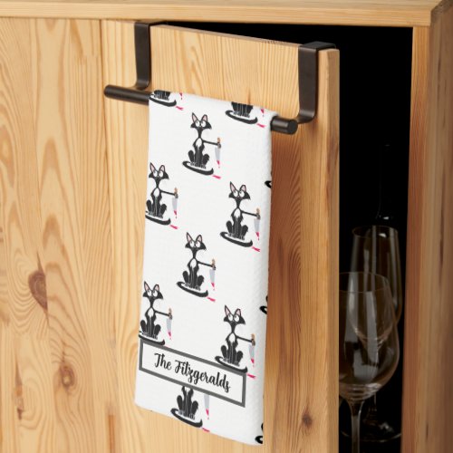Killer cat with a bloody knife kitchen towel
