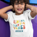 Kindergarten vibes back to school retro  T-Shirt<br><div class="desc">Get your little one ready for a back-to-school in style with this "Kindergarten Vibes" t-shirt! This retro-inspired design is bursting with cool colors and vintage flair and it's perfect for your trendy kiddo who's ready to rock their pre-K days. Customize it with the current year to create a unique keepsake...</div>
