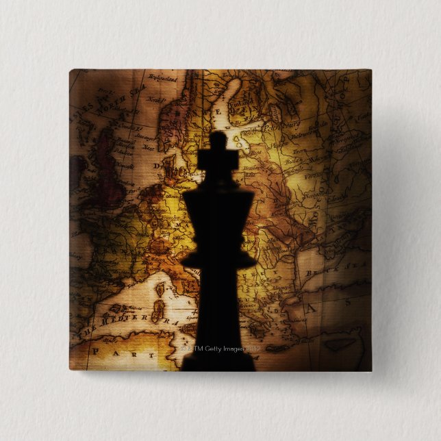 King chess piece on old world map button (Front)