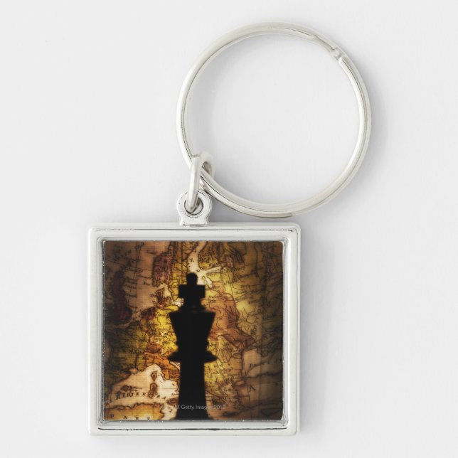 King chess piece on old world map keychain (Front)