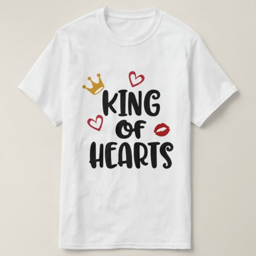 Step into the urban scene with our "King of Hearts" t-shirt, a statement piece that merges hip-hop flair with timeless romance. Crafted for the kings of the streets, this white tee features bold black lettering proclaiming "King of Hearts," adorned with a regal golden crown tilted proudly over the word "King." Adding a touch of passion, a single red lip kiss print catches the eye, while two small red hearts punctuate the message with love. This tee isn't just for the streets; it's a declaration of style and sentiment for men and boys alike, fitting for all ages from infants, toddlers & kids to teens & men. Our commitment to quality is unmatched, rivaling other top brands in the industry. Made with the finest materials, this tee ensures comfort and durability for all-day wear. Elevate your urban wardrobe with this fresh addition, perfect for those who appreciate the fusion of fashion and music in their clothing choices. Don't settle for ordinary when you can stand out with our "King of Hearts" tee. Affordable, graphic, and bursting with personality, it's more than just a shirt—it's a statement. A great Valentine's Day fashion accessory! Join the movement and make your mark in urban streetwear fashion today.