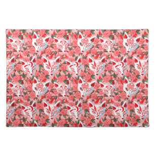 Kitsune masks and blooming camellia on pink cloth placemat