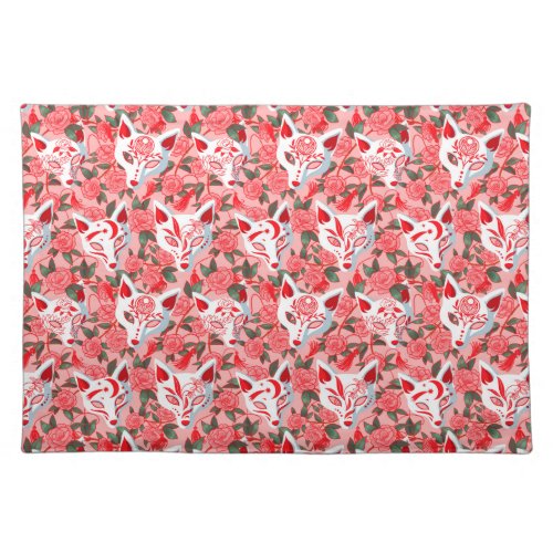 Kitsune masks and blooming camellia on pink cloth placemat