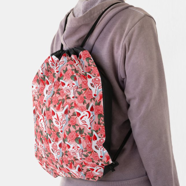 Kitsune masks and blooming camellia on pink drawstring bag (Insitu)