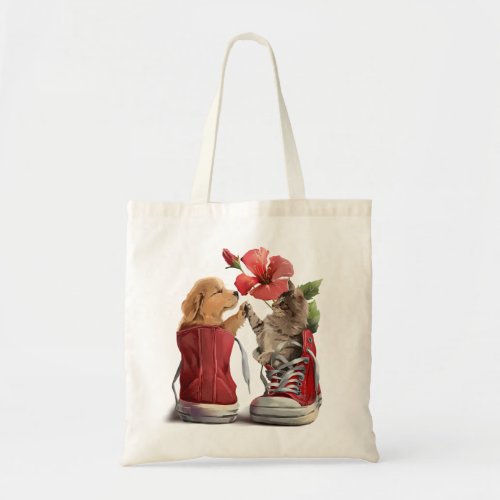 Kitten and puppy greet each other tote bag