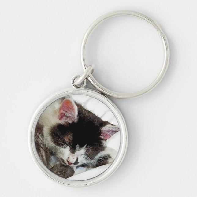 Kitten asleep on White Comforter Keychain (Front)