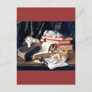 Kittens playing on a desk postcard
