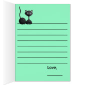 Kitty relaxing on green cards (Inside (Right))