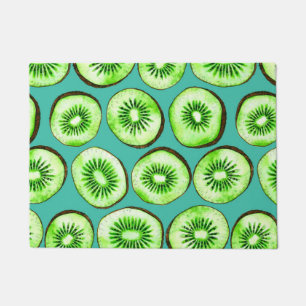 Kiwi slices on turquoise doormat