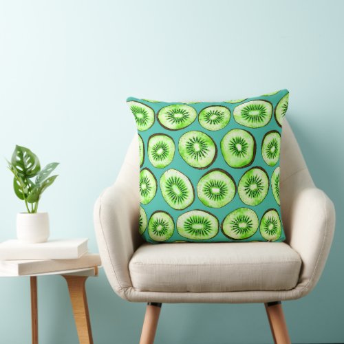 Kiwi slices on turquoise throw pillow