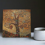 Klimt Golden Tree of Life Abstract Art Nouveau Cer Ceramic Tile<br><div class="desc">This stunning ceramic tile showcases an abstract Tree of Life inspired by Gustav Klimt's "golden phase." Klimt was fascinated by Byzantine mosaics and developed his own mosaic technique using gold leaf and bright colors. This artwork pays tribute to Klimt's innovative approach to mosaic and captures the opulent beauty of his...</div>