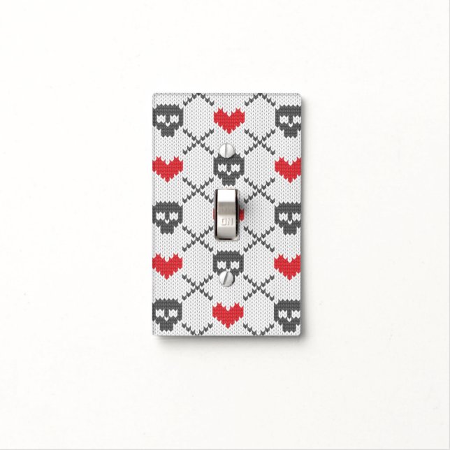 Knitted pattern with skulls light switch cover (In Situ)
