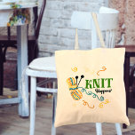 Knitting Humor Knit Happens Saying and Quirky Yarn Tote Bag<br><div class="desc">This quirky little design carries the timeless phrase "Knit Happens". The phrase is written in green and black mixed typography. The design features a ball of variegated yarn in teal blue,  vanilla,  mustard and spice together with knitting needles and some wiggly yarn tails.</div>