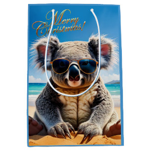 Koala on a sandy beach Merry Christmas Medium Gift Bag