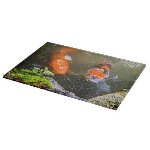 Koi fish in a pond cutting board