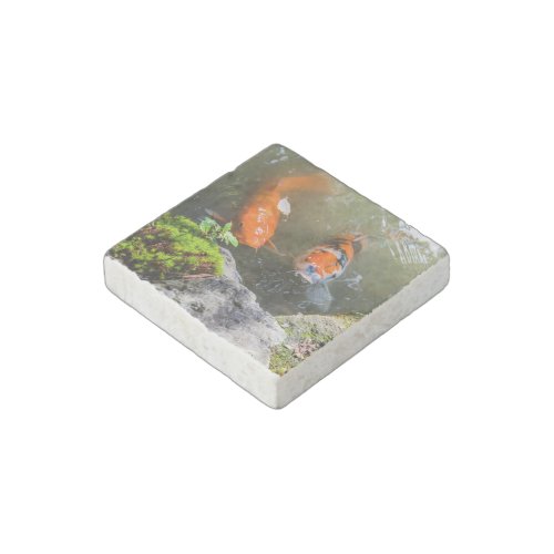 Koi fish in a pond stone magnet