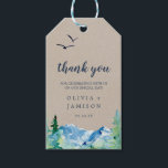 Kraft Rocky Mountain Wedding Thank You Favor Gift Tags<br><div class="desc">These kraft Rocky Mountain wedding thank you favor gift tags are perfect for an outdoor wedding. The design features a blue and green painted wilderness landscape with watercolor pine trees, birds and mountains on a faux light kraft paper background. Personalize the labels with your names and the date. Change the...</div>