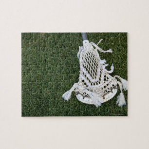 Lacrosse stick on grass jigsaw puzzle