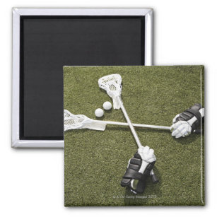 Lacrosse sticks, gloves and balls on artificial magnet