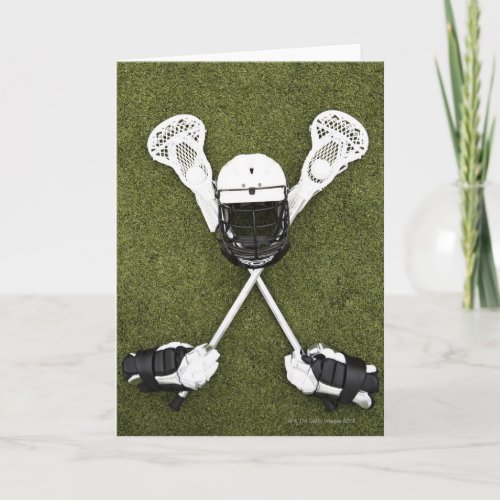 Lacrosse sticks gloves balls and sports helmet card