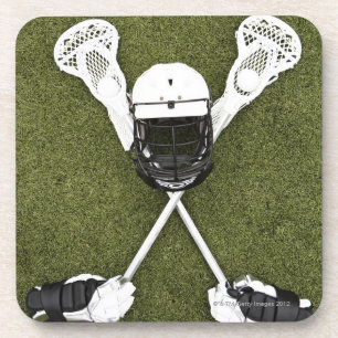 Lacrosse sticks, gloves, balls and sports helmet drink coaster