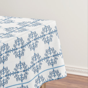 Lacy birds pattern in blue and white tablecloth