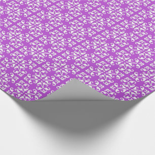 Lacy cutwork - white over amythyst purple wrapping paper