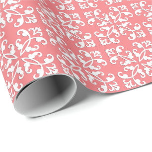 Lacy cutwork - white over coral pink wrapping paper