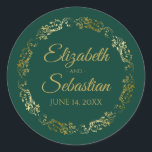 Lacy Gold Filigree Elegant Emerald Green Wedding Classic Round Sticker<br><div class="desc">These elegant wedding stickers feature fancy gold script text on an emerald green background with a lacy gold faux foil floral border. The text is fully customizable and contains the wedding couple's names and wedding date. Great as favor tags or envelope seals!</div>