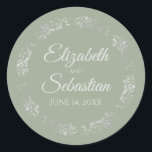 Lacy Silver Filigree Elegant Sage Green Wedding Classic Round Sticker<br><div class="desc">These elegant wedding stickers feature fancy pale gray script text on a sage green colored background with a lacy silver faux foil floral border. The text is fully customizable and contains the wedding couple's names and wedding date. Great as favor tags or envelope seals!</div>
