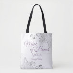 Lacy Silver & Lavender Maid of Honor White Wedding Tote Bag<br><div class="desc">This beautiful tote bag is designed as a gift, favor, or swag bag for your wedding Maid of Honor. The simple yet elegant design features ornate silver gray frills in the corners with fancy lavender purple script lettering. There is space for her name, as well as the names of the...</div>
