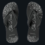 Lacy Silver on Black Elegant The Bride Wedding Flip Flops<br><div class="desc">Dance the night away with these beautiful wedding flip flops. Designed for the bride, they feature a simple yet elegant design with grey script lettering on a classic black background and fancy silver gray decorative curls and swirls. Beautiful way to stay fancy and appropriate while giving your feet a break...</div>