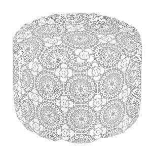 Lacy white squares on a light gray background pouf