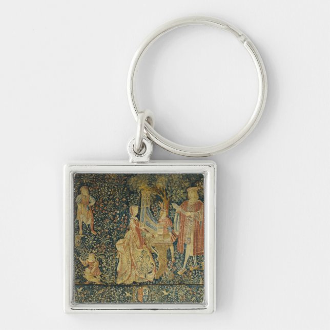 Lady playing the portative organ from keychain (Front)