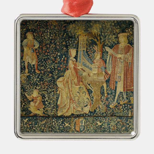 Lady playing the portative organ from metal ornament (Front)