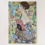 Lady with A Fan, Gustav Klimt Jigsaw Puzzle<br><div class="desc">Gustav Klimt (July 14, 1862 – February 6, 1918) was an Austrian symbolist painter and one of the most prominent members of the Vienna Secession movement. Klimt is noted for his paintings, murals, sketches, and other objets d'art. In addition to his figurative works, which include allegories and portraits, he painted...</div>