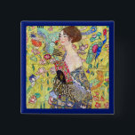 Lady with Fan by Gustav Klimt, Vintage Japonism Pinback Button<br><div class="desc">Lady with Fan (1918) by Gustav Klimt is a vintage Victorian Era Symbolism fine art portrait painting. A beautiful brunette woman holding an oriental fan. The golden floral Japanese themed background is full of blooming exotic flowers, peacocks and other birds with outstretched wings. About the artist: Gustav Klimt (1862-1918) was...</div>
