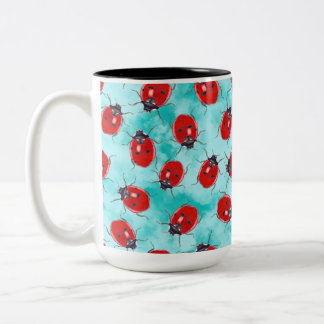 Ladybug garden friend tossed on aqua Two-Tone coffee mug