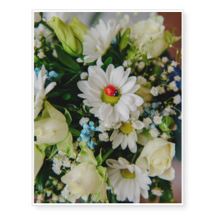 Ladybug on a white flower temporary tattoos
