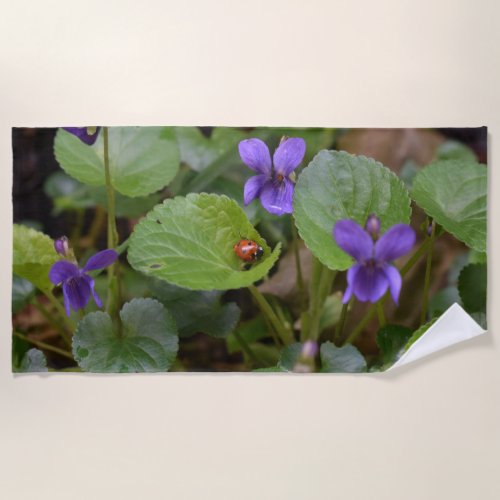 Ladybug on Sweet Violet Flowers Beach Towel