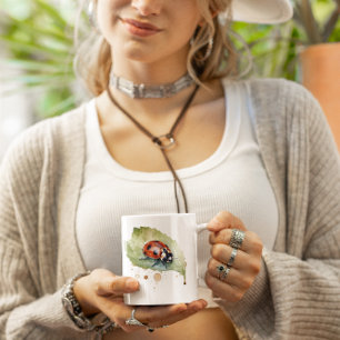Ladybug sitting on a leaf in vibrant watercolor coffee mug