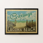 Laguna Beach Vintage Travel Jigsaw Puzzle<br><div class="desc">This Greetings From Laguna Beach vintage postcard design features a sandy beach with a beautiful turquoise ocean water and above the sea,  a blue sky with billowy white clouds. In vintage travels style.</div>